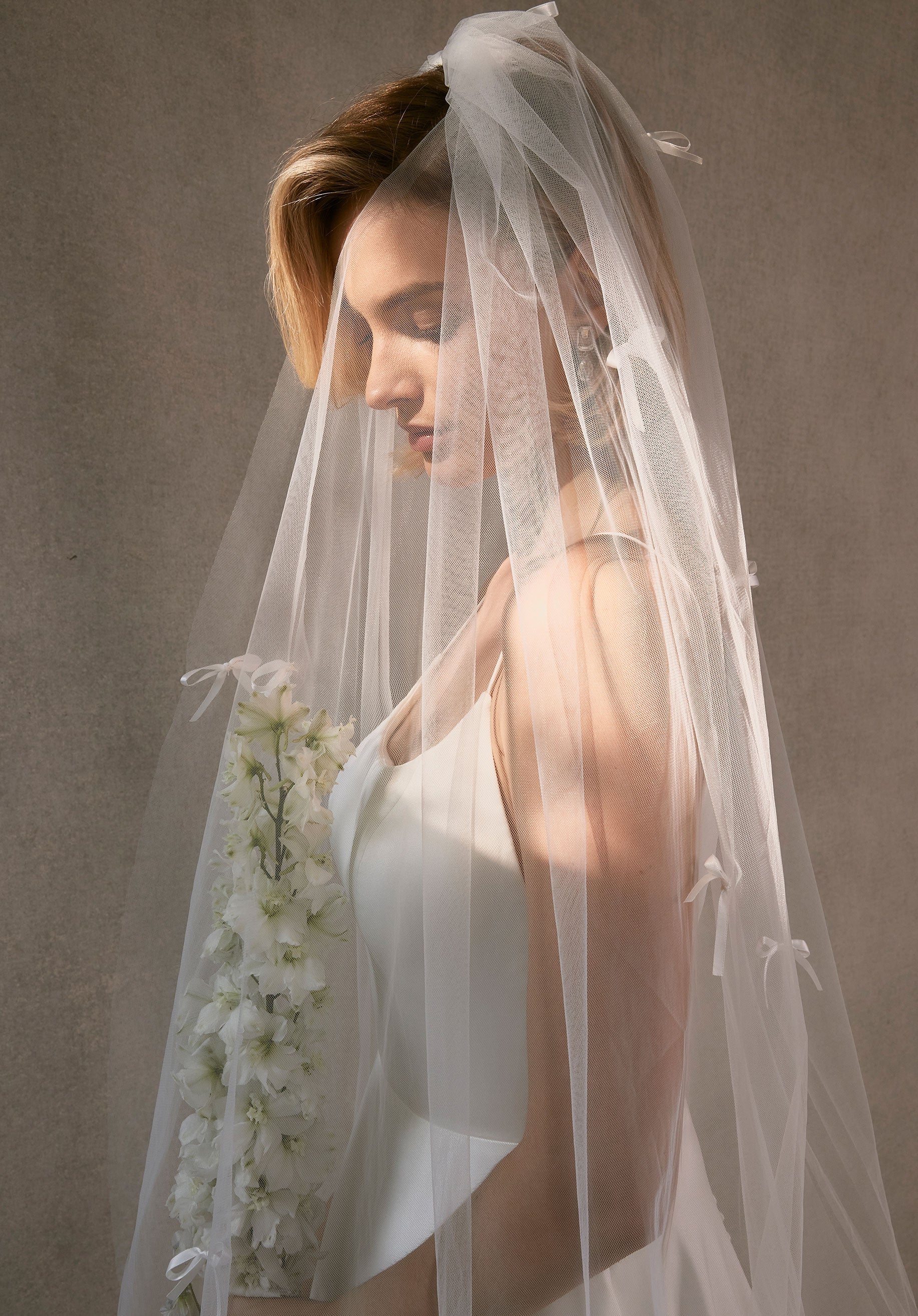 Cathedral Length Tulle Veil with Scattered Satin Bows - Image 4